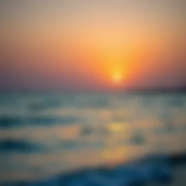 A serene sunset over the tranquil waters of Hudariyat Beach